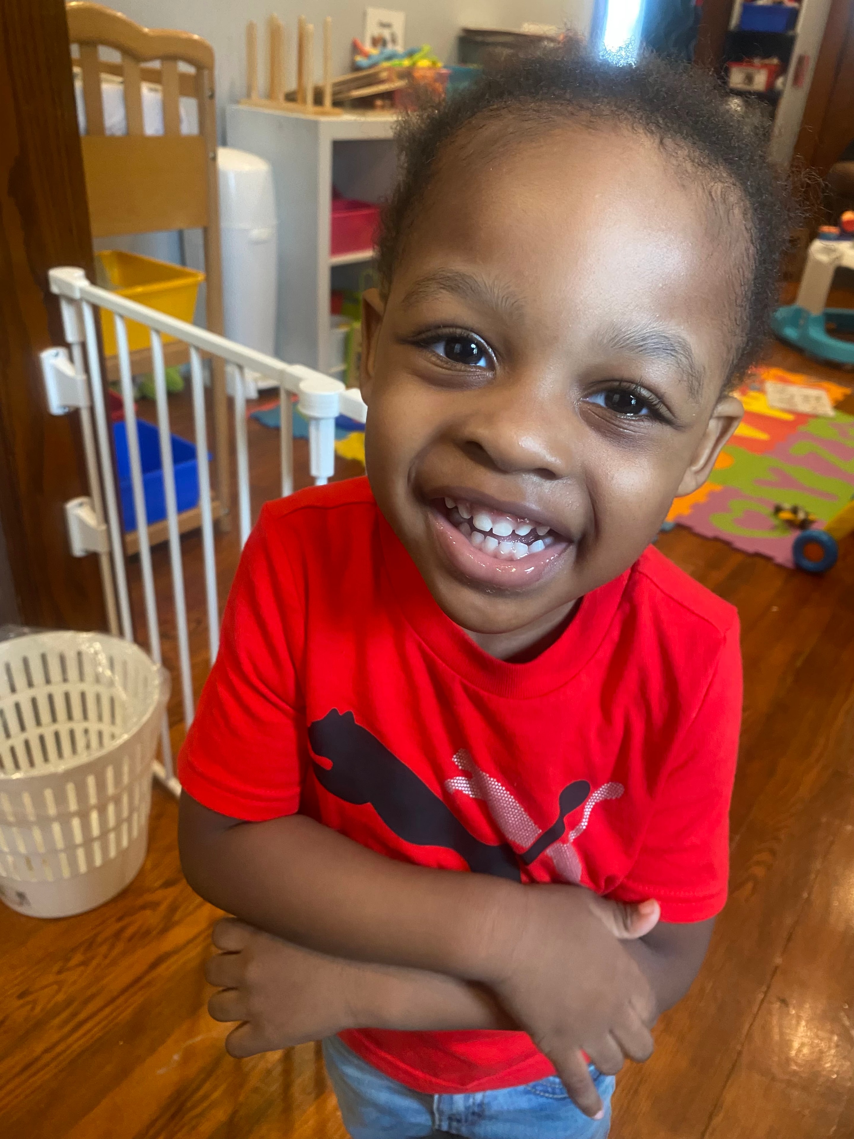 Caregiver reading to a toddler in a warm home setting